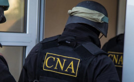 Un executor judecătoresc și un om de afaceri reținuți de CNA