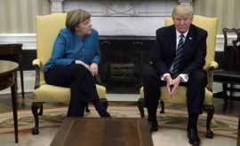 Trump iar fi înmînat lui Merkel o factură de 300 de miliarde de dolari